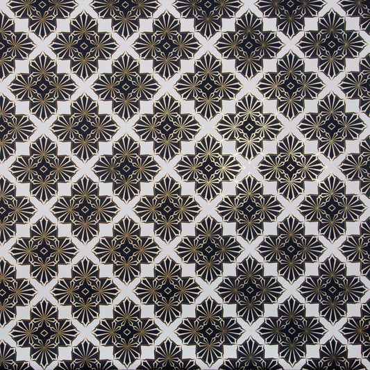 Flat lay of Blaze 'Inhale' wallcovering's geometric pattern in black and gold on a white background.