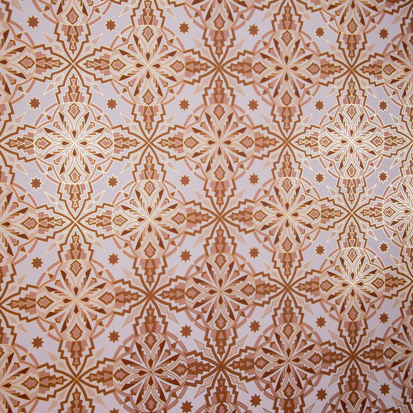 Flat lay of Cha Cha 'Chill' wallcovering featuring an intricate geometric pattern in gold and beige tones.