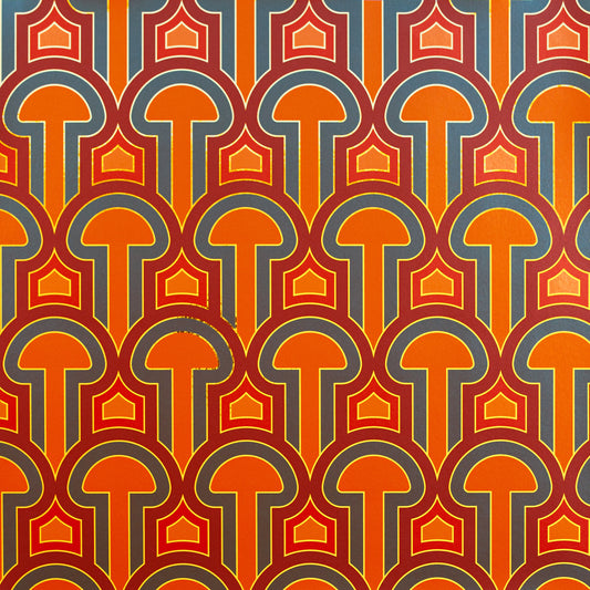 A close-up of the Enlightenment 'Panaeolus' wallpaper in orange, red, and charcoal.