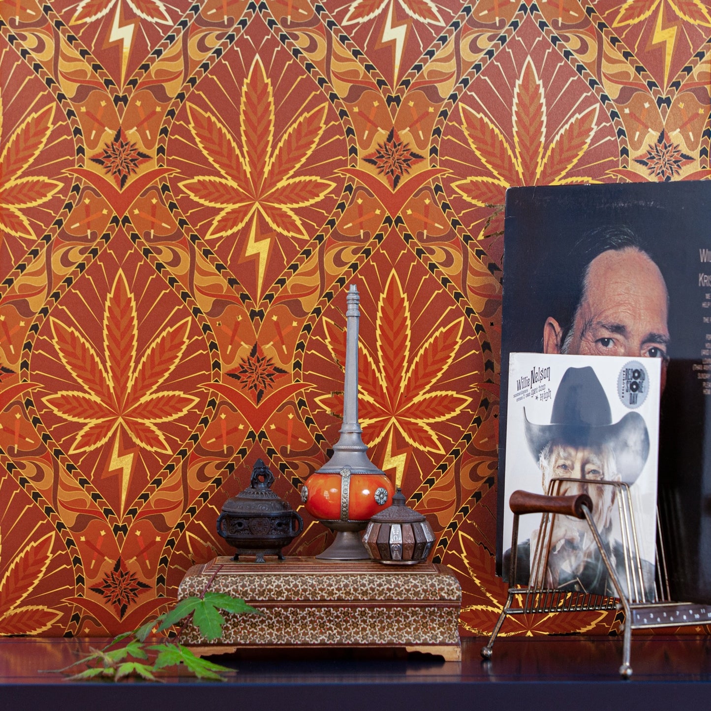 Eclectic decor and Willie Nelson albums styled against the ornate High Style 'High Class' wallcovering.