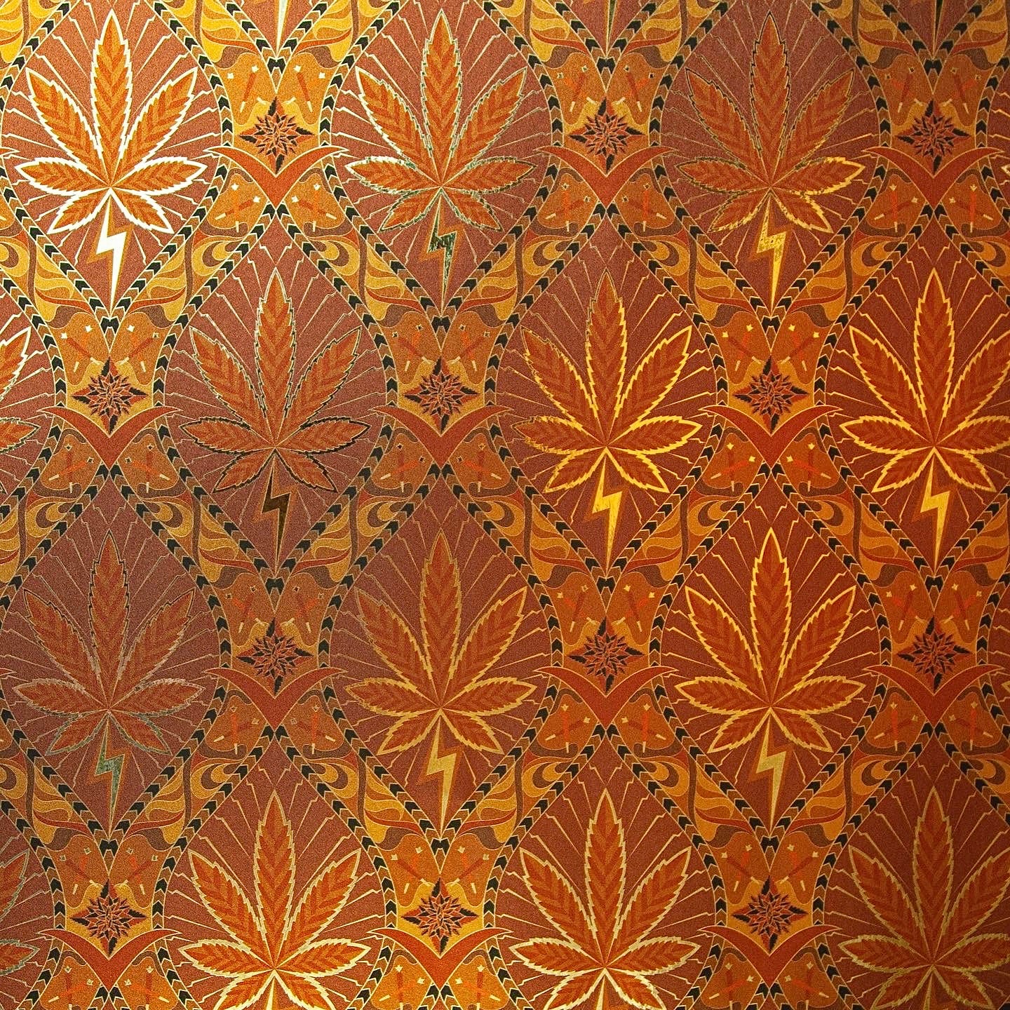 High Style High Class is a gothic revival inspired cannabis marijuana grass weed themed repeat pattern wallpaper featuring joints, buds, cannabis leaves, smoke motif, in metallic browns, coppers and oranges, all outlined in gold and digitally printed on gold mylar
