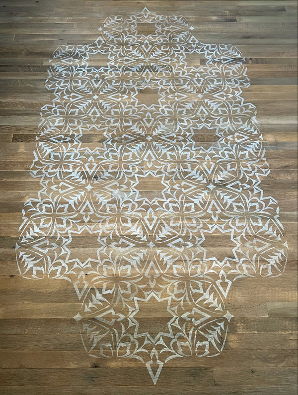 A close up of the painted rug.