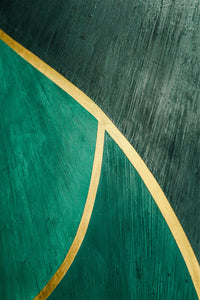 Highly pigmented in emerald jewel textured plaster in the Hollywood regency style with 24kt gold leaf. Detail shows textured plaster against gold leaf on single planel.