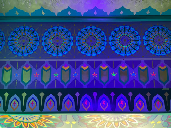 Panels installed and illuminated by black light.