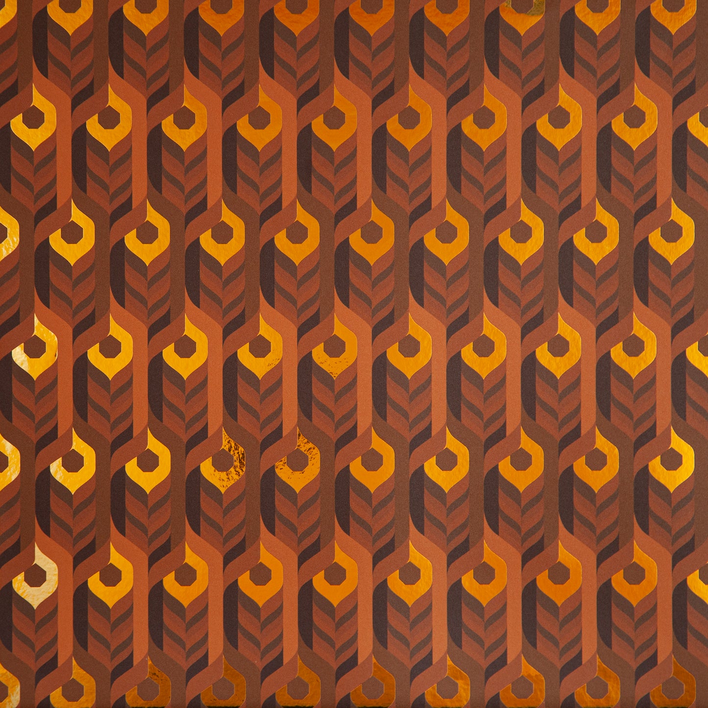 A close-up of the Integratronic 'Desert' Wallcovering shows its warm, 3D geometric pattern.