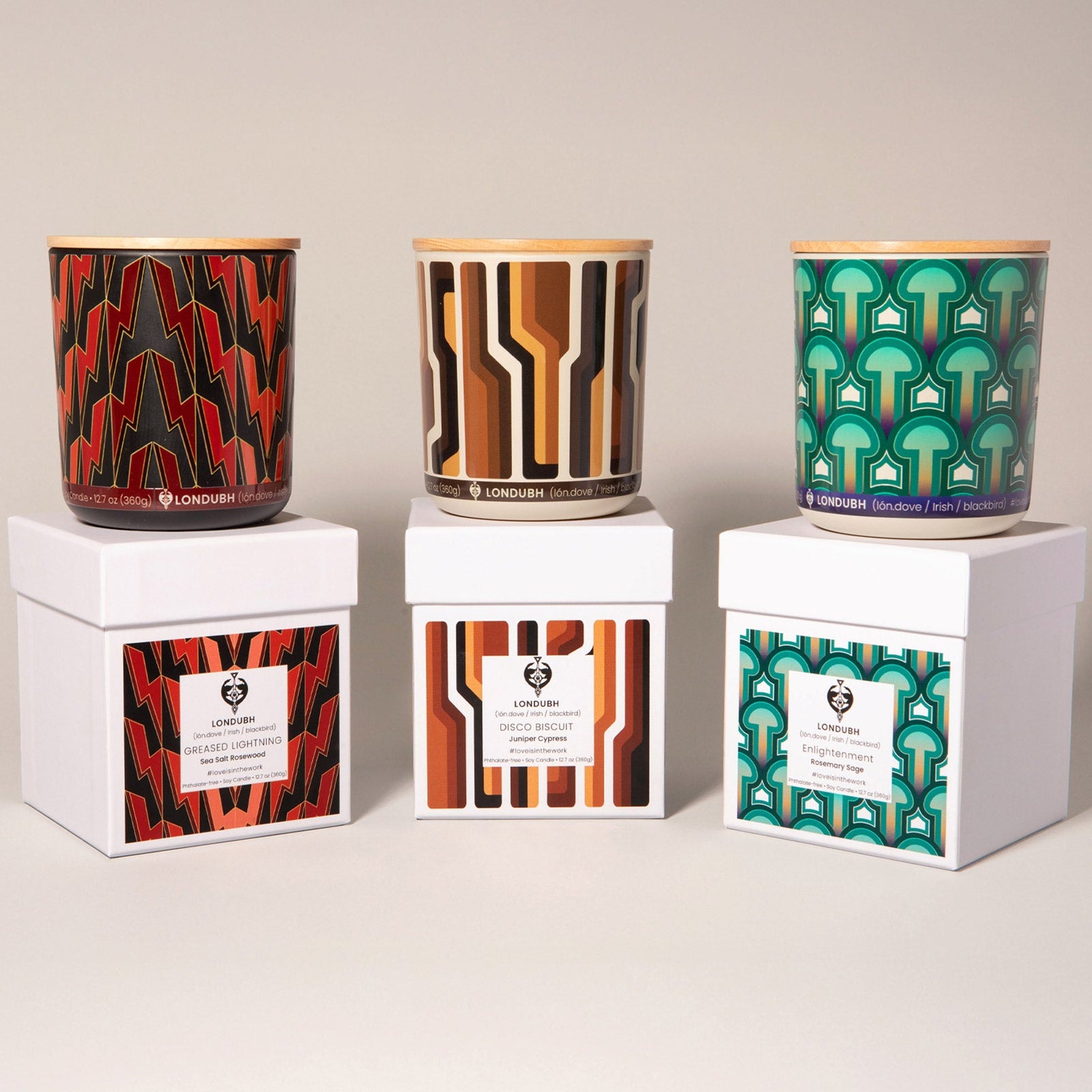 The Londubh Candle Set showing the Greased Lightning, Disco Biscuit, and Enlightenment candles with their matching boxes.