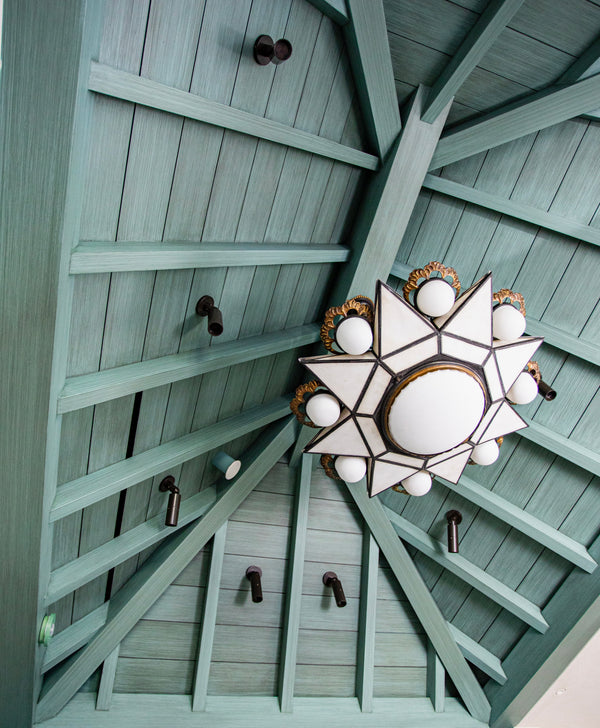 A wider focus on the striéd ceiling.