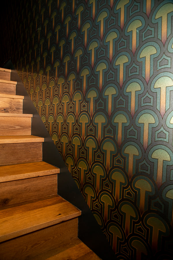 A close up view of Londubh's shimmering metallic Enlightenment Psilocybe wallcovering.