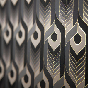 Neowise Classical is a repeat pattern wallpaper inspired by Neowise, a comet that flew over Newgrange in Ireland. Neowise Classical looks like a feather motif but is inspired by grain, and is black, an ombre of gray tones, white, outlined in gold, and printed on gold mylar - shown here at an angle with the light reflecting off the gold outlines