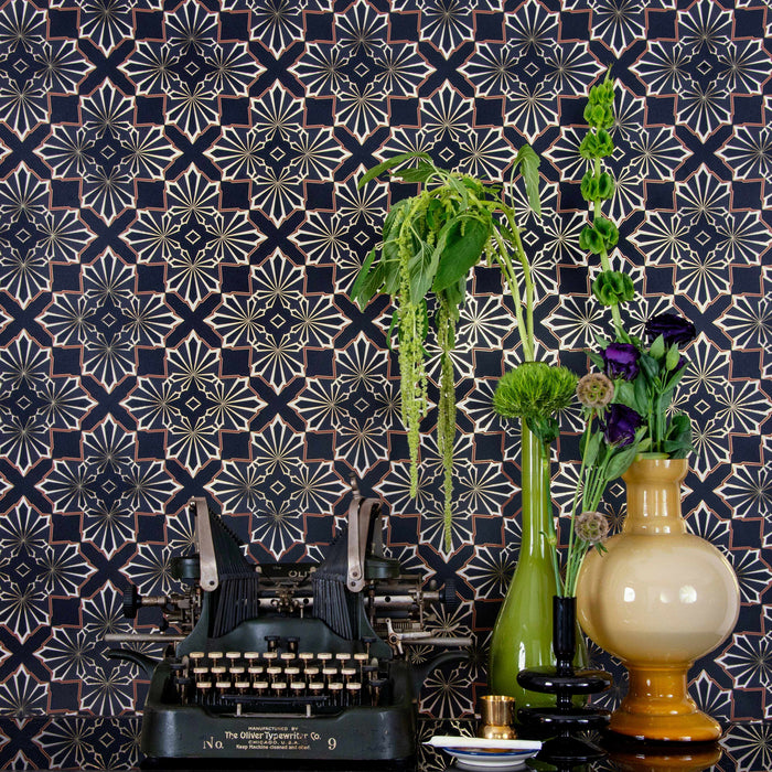 Blaze 'Exhale' Wallcovering behind a vintage typewriter and colorful mid-century modern vases.