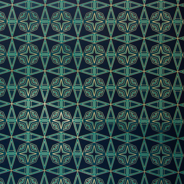 Integratronic Plush is a mid-century retro repeat geometric pattern featuring motifs in various greens on a darkest green background all outlined in gold and digitally printed on gold mylar  - shown here at an angle with light illuminating the gold outlines