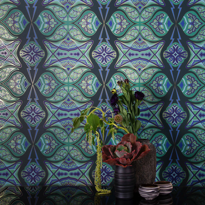 Ulu 'Canopy' Wallcovering in deep greens and blues creates a dramatic backdrop for a tablescape.