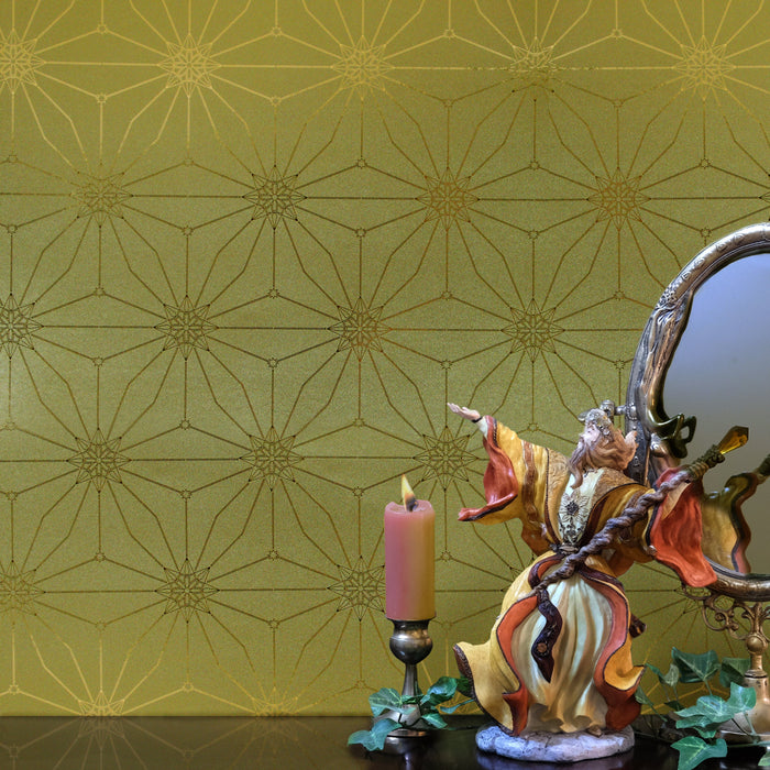 Star Guitar 'Dawn' wallcovering with a golden geometric pattern behind a vanity vignette.
